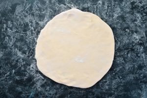 dough ball, rolled out flat