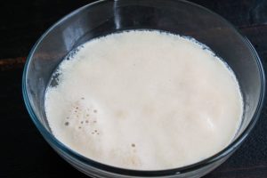 Yeast and sugar foaming up in warm water