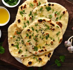 Naan bread with butter and herbs on top