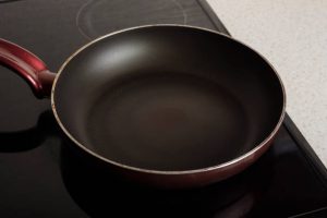 Empty frying pan on the stove