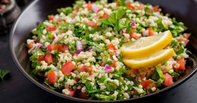 Tabbouleh salad. Traditional middle eastern or arab dish. Levantine vegetarian salad with parsley, mint, bulgur, tomato.