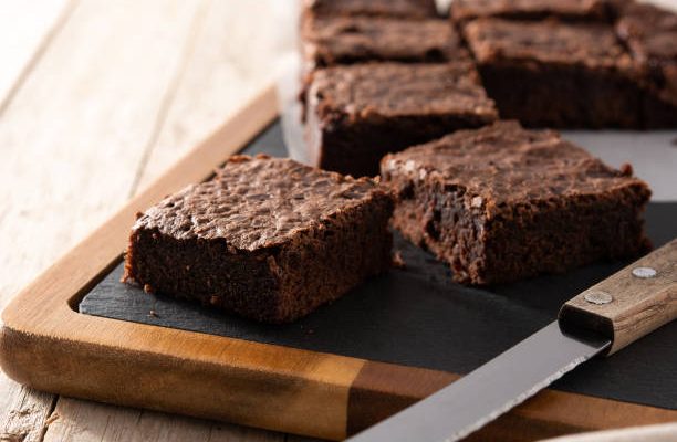 Homemade brownie on wooden table